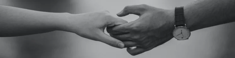 A picture of people holding hands.